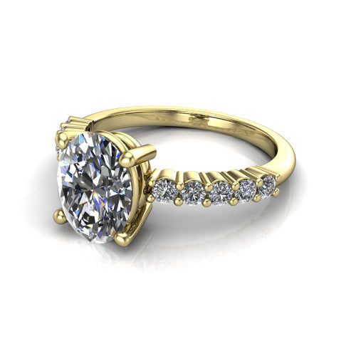 Fernanda oval solitaire engagement ring in 18K Yellow Gold, three-quarter perspective showing the oval center diamond, 4-prong setting, and shared-prong pave band