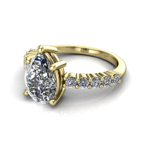 Fernanda pear solitaire engagement ring in 14K Yellow Gold, three-quarter perspective showing the pear center diamond, 4-prong setting, and shared-prong pave band