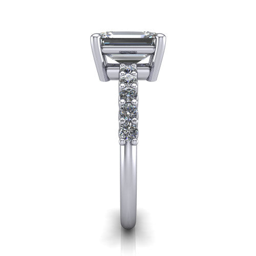 Fernanda emerald solitaire engagement ring in 14K White Gold, side profile showing the 4-prong head and shared-prong pave band