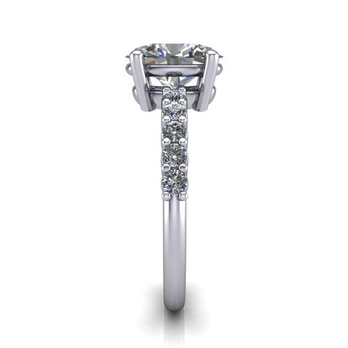 Fernanda oval solitaire engagement ring in Platinum, side profile showing the 4-prong head and shared-prong pave band