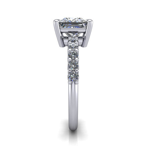 Fernanda princess solitaire engagement ring in 18K White Gold, side profile showing the 4-prong head and shared-prong pave band
