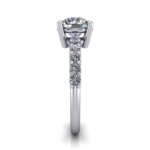 Fernanda round solitaire engagement ring in Platinum, side profile showing the 4-prong head and shared-prong pave band