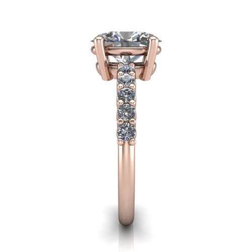 Fernanda oval solitaire engagement ring in 14K Rose Gold, side profile showing the 4-prong head and shared-prong pave band