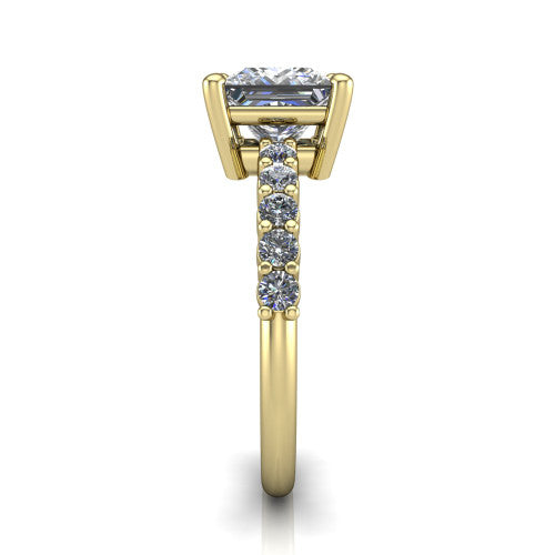 Fernanda princess solitaire engagement ring in 14K Yellow Gold, side profile showing the 4-prong head and shared-prong pave band