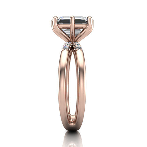 Raven emerald solitaire engagement ring in 18K Rose Gold, side profile showing the accent diamonds along the dual band