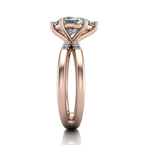 Raven pear solitaire engagement ring in 18K Rose Gold, side profile showing the accent diamonds along the dual band