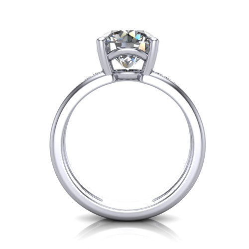 Fiona round solitaire engagement ring in Platinum, through-finger front profile showing the open cathedral basket