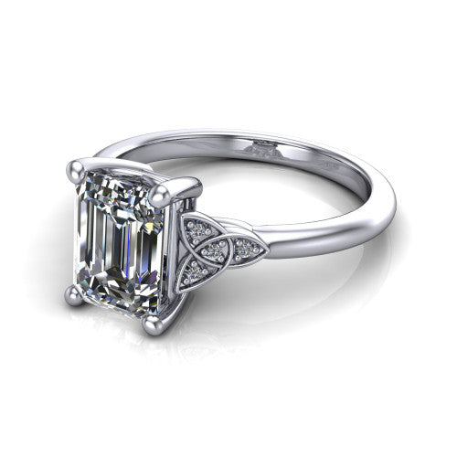 Lilith emerald solitaire engagement ring in 18K White Gold, three-quarter perspective showing the emerald center diamond with Celtic knot shoulders