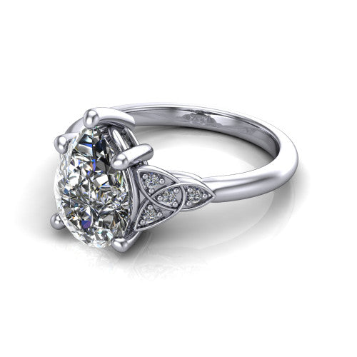 Lilith pear solitaire engagement ring in 18K White Gold, three-quarter perspective showing the pear center diamond with Celtic knot shoulders