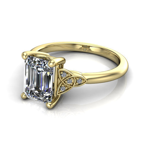 Lilith emerald solitaire engagement ring in 18K Yellow Gold, three-quarter perspective showing the emerald center diamond with Celtic knot shoulders