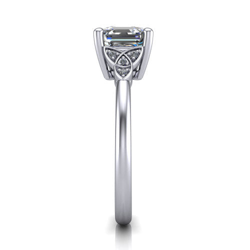 Lilith square emerald solitaire engagement ring in 18K White Gold, side profile showing the Celtic trinity knot accent and polished band