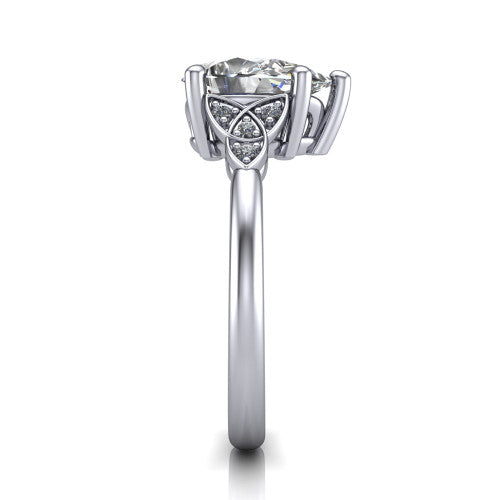 Lilith pear solitaire engagement ring in Platinum, side profile showing the Celtic trinity knot accent and polished band