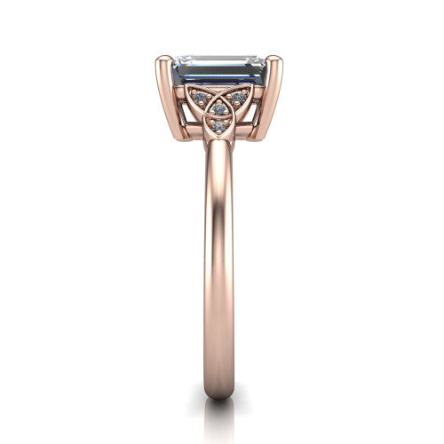 Lilith emerald solitaire engagement ring in 14K Rose Gold, side profile showing the Celtic trinity knot accent and polished band