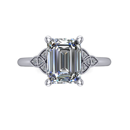 Lilith emerald solitaire engagement ring in Platinum, top-down view showing the four-prong emerald center diamond and knot accents