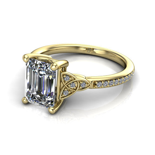 Samara emerald-cut Celtic engagement ring in 18K Yellow Gold, three-quarter perspective showing the emerald-cut center diamond, Celtic trinity-knot shoulders, and pavé band