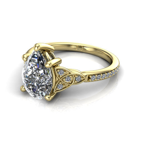Samara pear-shaped Celtic engagement ring in 18K Yellow Gold, three-quarter perspective showing the pear-shaped center diamond, Celtic trinity-knot shoulders, and pavé band