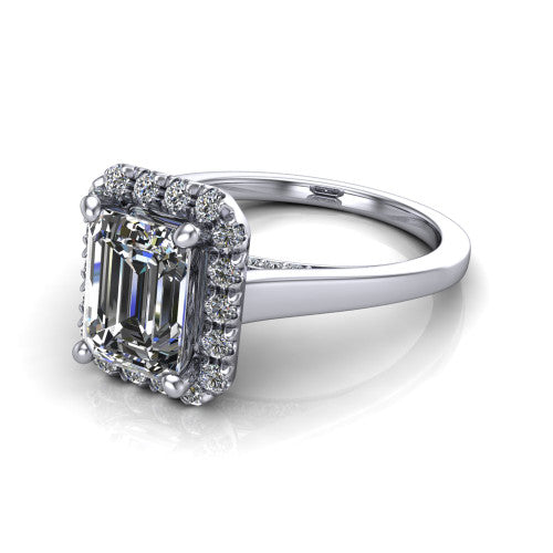 Helen emerald-cut halo engagement ring in 18K White Gold, three-quarter perspective showing the emerald-cut center diamond, pavé halo, and polished band