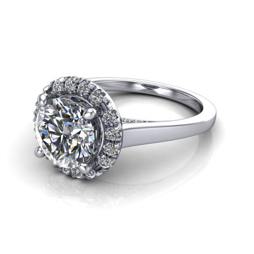 Helen round halo engagement ring in Platinum, three-quarter perspective showing the round center diamond, pavé halo, and polished band
