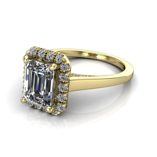 Helen emerald-cut halo engagement ring in 14K Yellow Gold, three-quarter perspective showing the emerald-cut center diamond, pavé halo, and polished band
