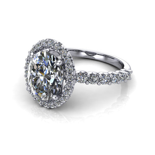 Mabel oval halo engagement ring in Platinum, three-quarter perspective showing the oval center diamond in a pave halo above a shared-prong pave band