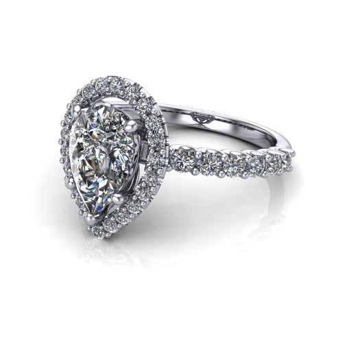 Mabel pear halo engagement ring in Platinum, three-quarter perspective showing the pear center diamond in a pave halo above a shared-prong pave band