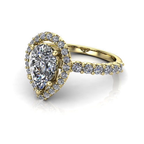 Mabel pear halo engagement ring in 18K Yellow Gold, three-quarter perspective showing the pear center diamond in a pave halo above a shared-prong pave band