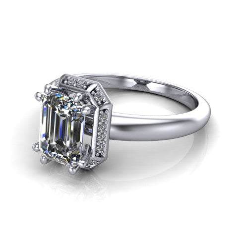 Maris emerald-cut vintage halo engagement ring in Platinum, three-quarter perspective showing the emerald-cut center diamond, octagonal milgrain halo, and polished band