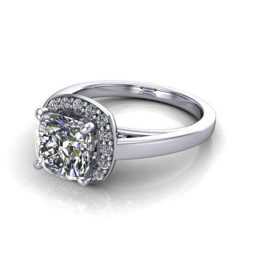 Coralie cushion-cut halo engagement ring in 14K White Gold, three-quarter perspective showing the cushion-cut center diamond, milgrain pavé halo, and polished band