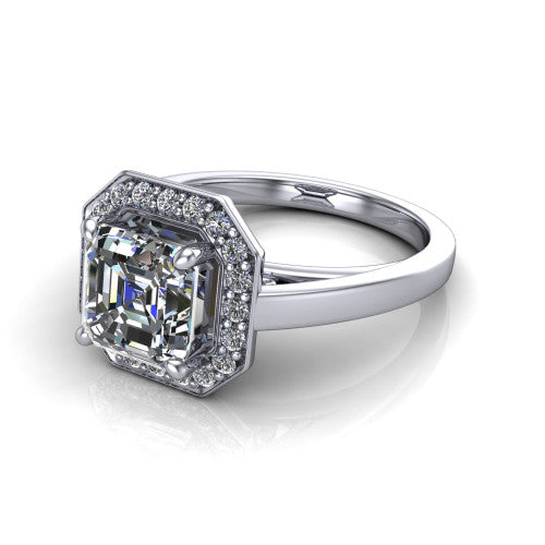 Coralie square emerald-cut halo engagement ring in 18K White Gold, three-quarter perspective showing the square emerald-cut center diamond, milgrain pavé halo, and polished band