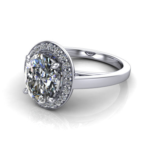 Coralie oval halo engagement ring in 14K White Gold, three-quarter perspective showing the oval center diamond, milgrain pavé halo, and polished band