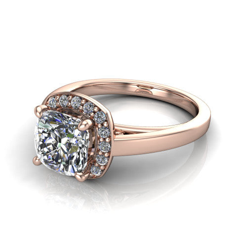Coralie cushion-cut halo engagement ring in 14K Rose Gold, three-quarter perspective showing the cushion-cut center diamond, milgrain pavé halo, and polished band