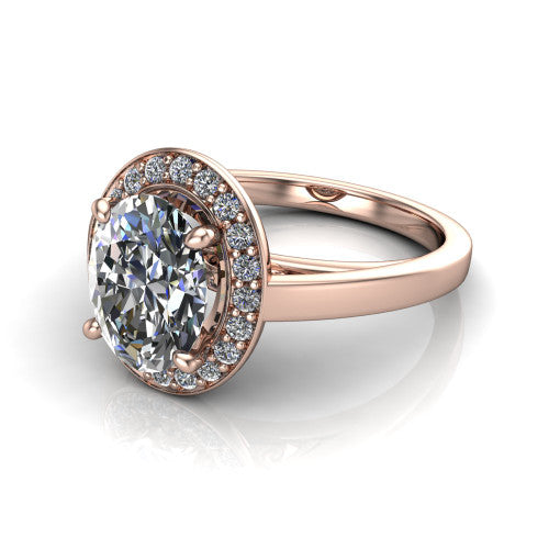 Coralie oval halo engagement ring in 18K Rose Gold, three-quarter perspective showing the oval center diamond, milgrain pavé halo, and polished band