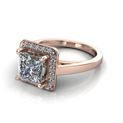 Coralie princess-cut halo engagement ring in 18K Rose Gold, three-quarter perspective showing the princess-cut center diamond, milgrain pavé halo, and polished band