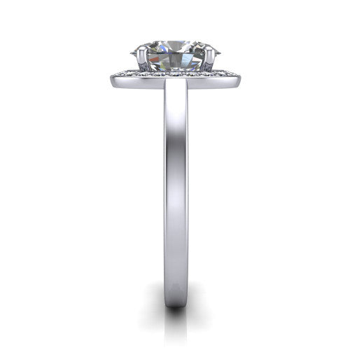 Coralie oval halo engagement ring in Platinum, side profile showing the pavé halo, filigree gallery, and polished band