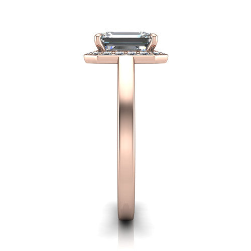 Coralie emerald-cut halo engagement ring in 14K Rose Gold, side profile showing the pavé halo, filigree gallery, and polished band