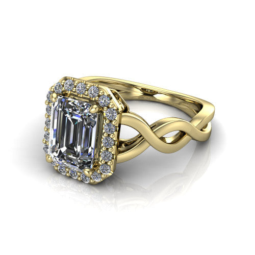 Demi emerald-cut halo engagement ring in 14K Yellow Gold, three-quarter perspective showing the emerald-cut center diamond, pavé halo, and infinity-twist shank