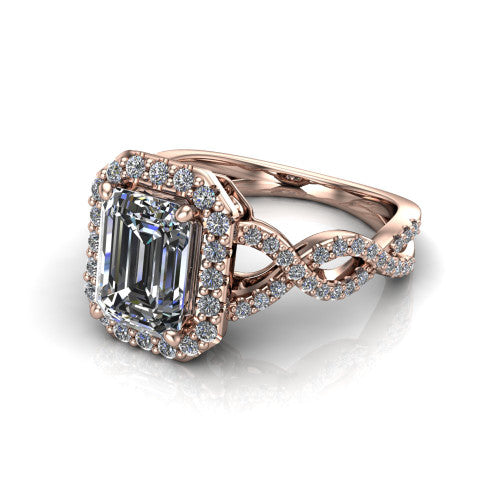 Azalea emerald-cut double halo engagement ring in 14K Rose Gold, three-quarter perspective showing the emerald-cut center diamond, double halo, and infinity-twist pavé shank