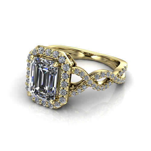 Azalea emerald-cut double halo engagement ring in 14K Yellow Gold, three-quarter perspective showing the emerald-cut center diamond, double halo, and infinity-twist pavé shank