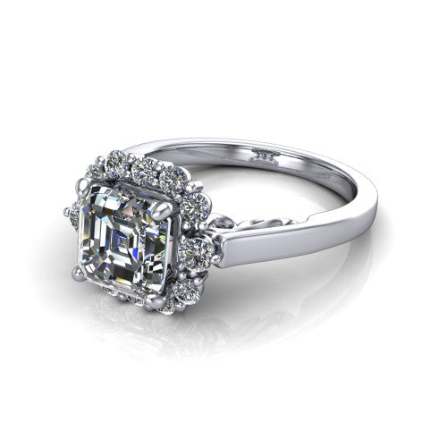 Elise square emerald halo engagement ring in Platinum, three-quarter perspective showing the square emerald center diamond in a vintage cluster halo above a polished band