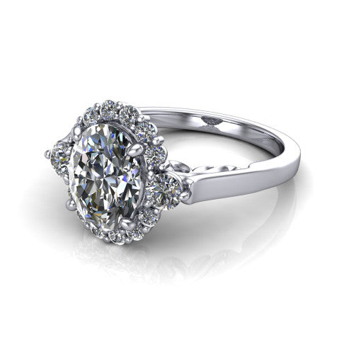 Elise oval halo engagement ring in Platinum, three-quarter perspective showing the oval center diamond in a vintage cluster halo above a polished band