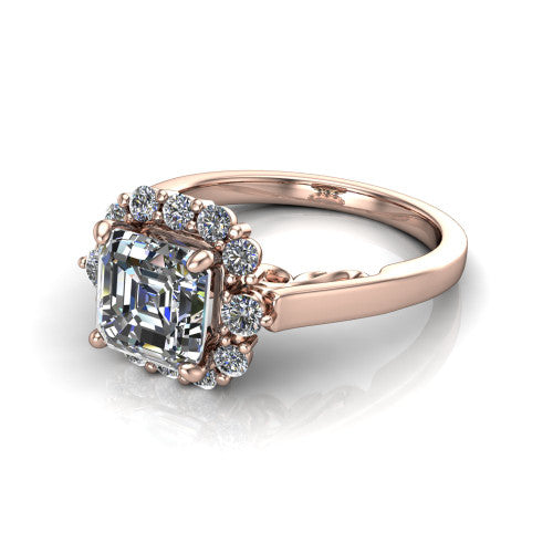 Elise square emerald halo engagement ring in 14K Rose Gold, three-quarter perspective showing the square emerald center diamond in a vintage cluster halo above a polished band