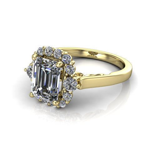 Elise emerald halo engagement ring in 18K Yellow Gold, three-quarter perspective showing the emerald center diamond in a vintage cluster halo above a polished band