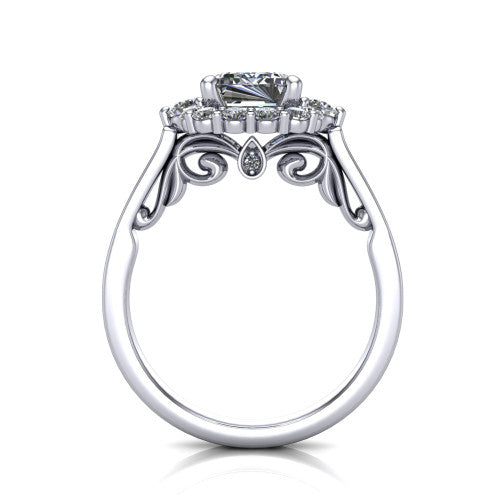 Elise emerald halo engagement ring in Platinum, through-finger front profile showing the filigree scrollwork gallery and bezel accent