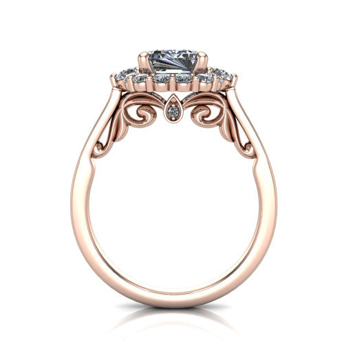 Elise emerald halo engagement ring in 14K Rose Gold, through-finger front profile showing the filigree scrollwork gallery and bezel accent