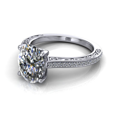 Nicole oval solitaire engagement ring in 14K White Gold, three-quarter perspective showing the oval center diamond above a pave band with scrollwork engraving