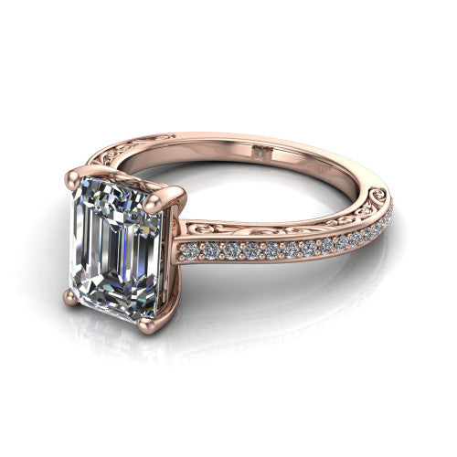 Nicole emerald solitaire engagement ring in 14K Rose Gold, three-quarter perspective showing the emerald center diamond above a pave band with scrollwork engraving