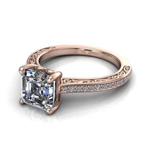 Nicole square emerald solitaire engagement ring in 18K Rose Gold, three-quarter perspective showing the square emerald center diamond above a pave band with scrollwork engraving