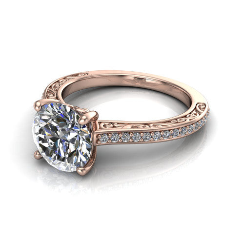 Nicole round solitaire engagement ring in 14K Rose Gold, three-quarter perspective showing the round center diamond above a pave band with scrollwork engraving