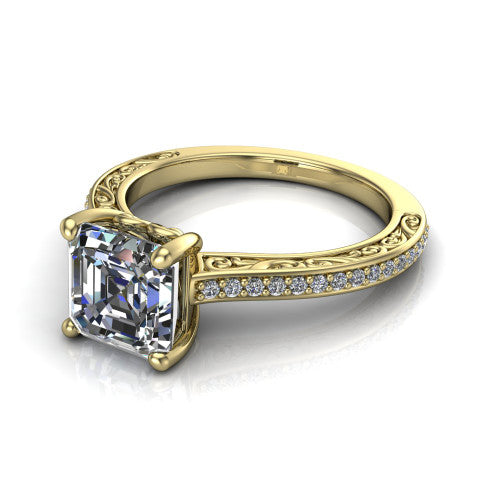 Nicole square emerald solitaire engagement ring in 18K Yellow Gold, three-quarter perspective showing the square emerald center diamond above a pave band with scrollwork engraving