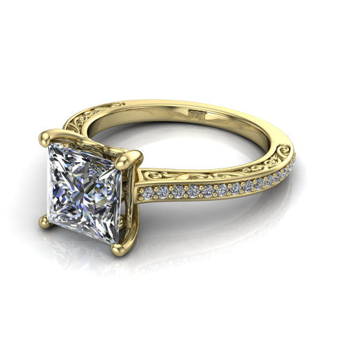 Nicole princess solitaire engagement ring in 14K Yellow Gold, three-quarter perspective showing the princess center diamond above a pave band with scrollwork engraving